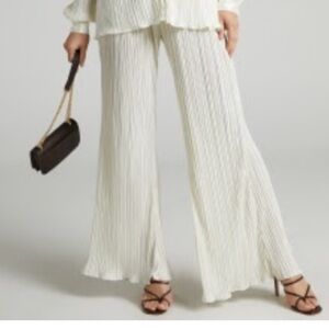 BECA PANTS - HIGH WAISTED PLISSE FLARED PANTS IN CREAM